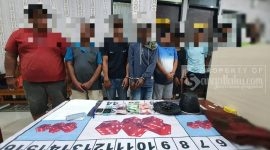 Kesembilang terduga pelaku judi dadu beserta barang bukti. (foto: /Istimewa)